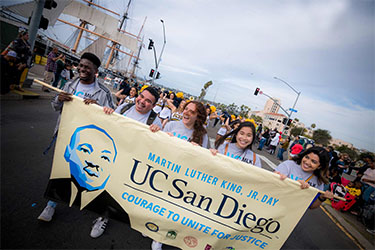 https://www.globalimpactmag.com/wp-content/uploads/2025/03/mlk-parade-2020.jpg