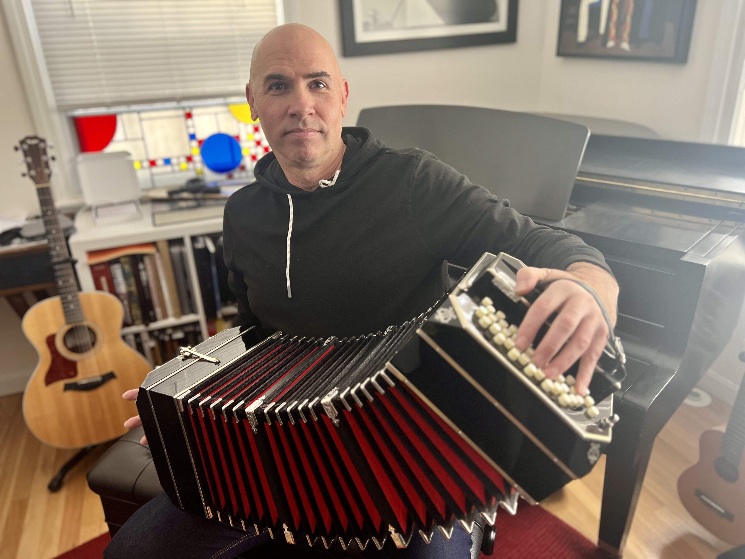 Eric Shimelonis plays the bandoneon, an instrument which originated in Germany before migrating to South America. (image courtesy of Rebecca Sheir)